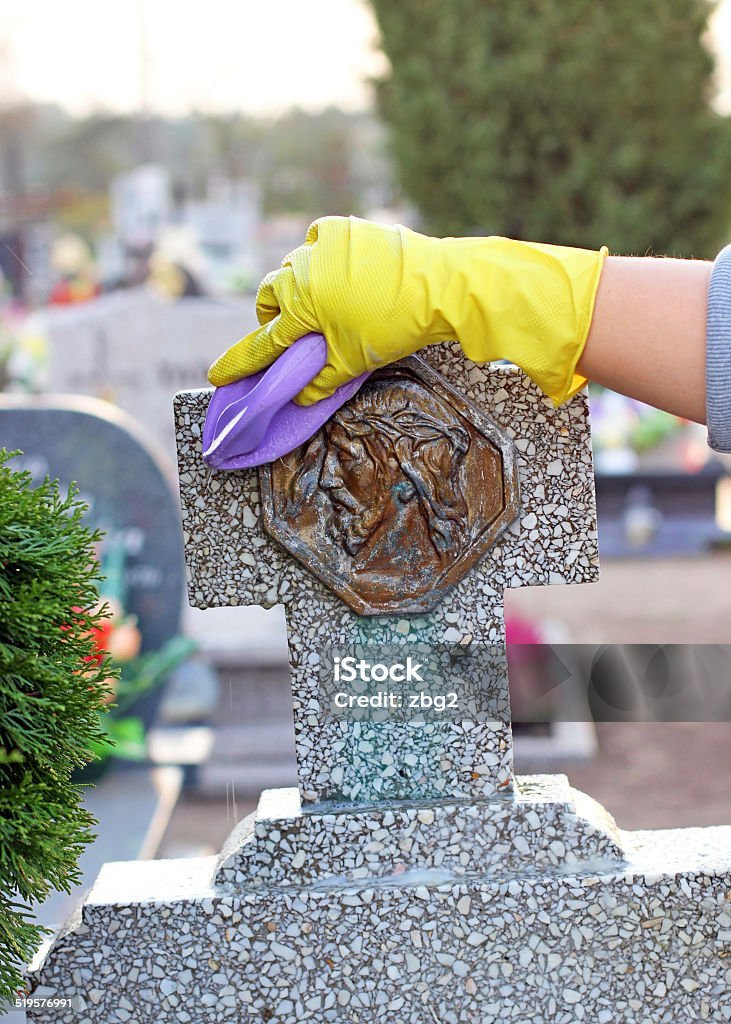 cleaning of the monument at the cemetery before All Saints Day, Poland